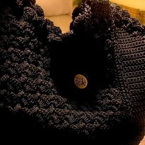 The SAK crochet double handle tote. Measures 15"W x 10"H.   Black. New.